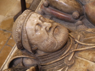 The head of Sir Thomas 9th Baron Roos of Belvoir carved in alabaster on his chest tomb in the chancel of St Mary's, Bottesford | Neil Fortey