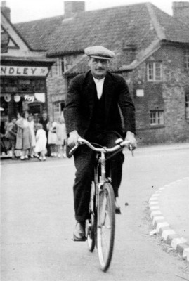 Mr Slater cycling past Standley's store Mr Slater cycling past Standley's store