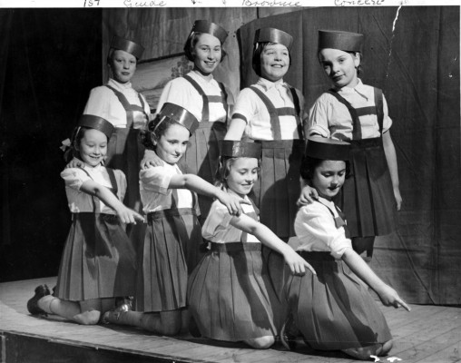 Brownies pose during a stage performance