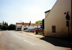 Snap shot of Nichols Car Sales and the Mower Shop on the High Street