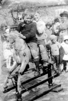 Two boys on rocking horse