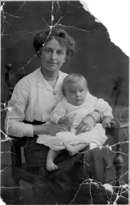 Studio portait of young woman and baby