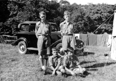 Scouts on camp, car in background