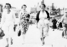 Three ladies strolling probably along the front in Skegness