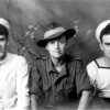 Studio portrait of three wartime servicemen