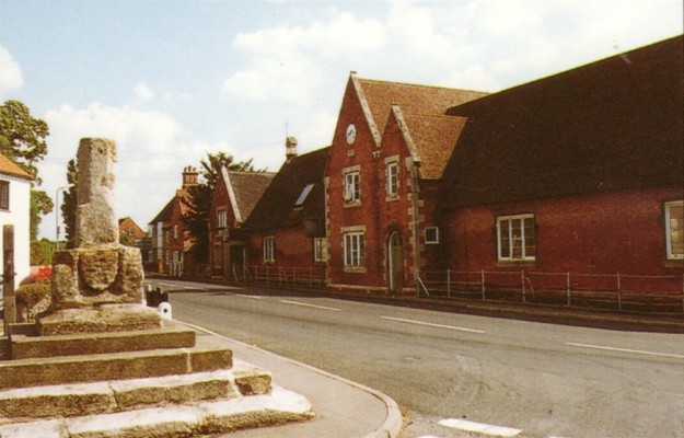 Colour postcard of Market Cross and village school