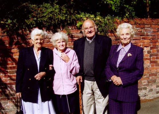 colour picture of four friends in Church St, Mrs Ada Bond second from left