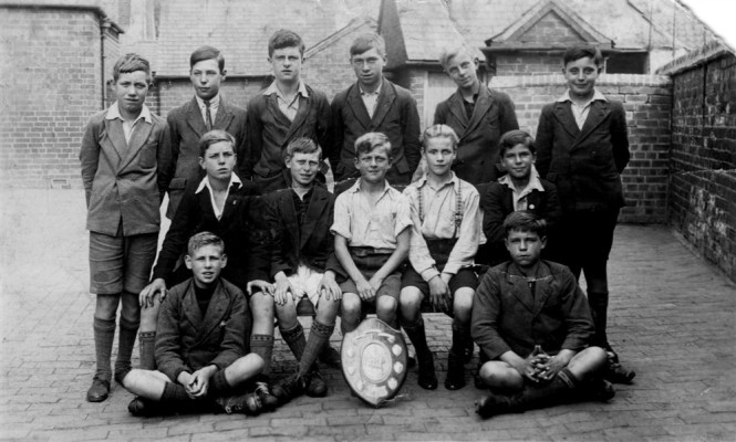 village school boys sports team in school yard
