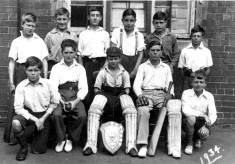 village school cricket team in school yard 1934