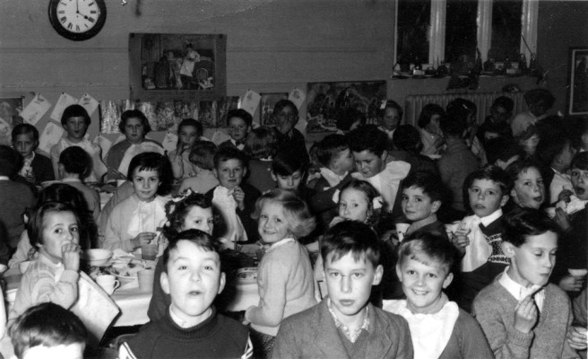 village school children enjoying school dinner