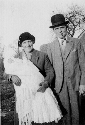 picture of grandparents holding new grandchild