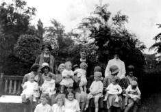 Mrs Lewis with children and nannies in The Park, Nottingham