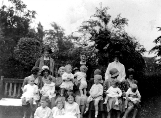 Mrs Lewis with children and nannies in The Park, Nottingham
