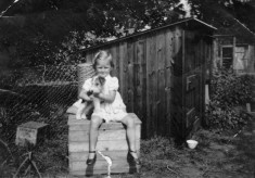 Gina Topps and pet terrier in a garden