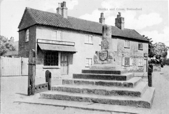 Postcard of Cross and Stocks at Bottesford