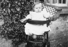 A baby in her high chair at The Elms