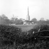 The church spire and Church Farm from Station Road