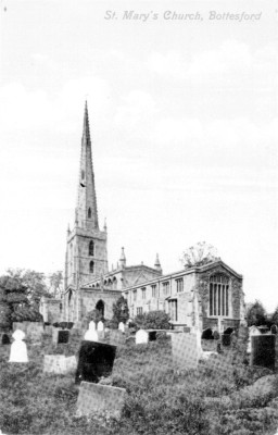 A postcard of Bottesford church seen across the churchyard