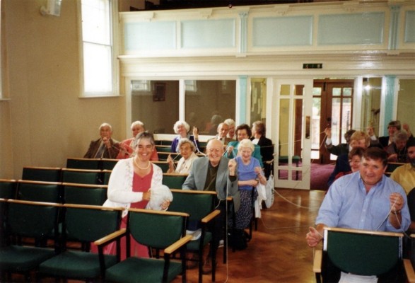 Members of the chapel trying out the new seating - 2