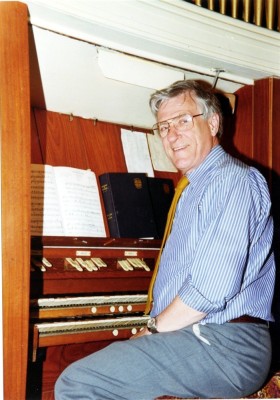 Mr John Simpson at the keyboard of the old chapel organ