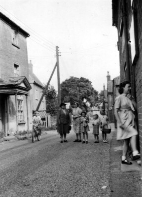 Ladies and children in Chapel Street, Singleton's farmhouse on left