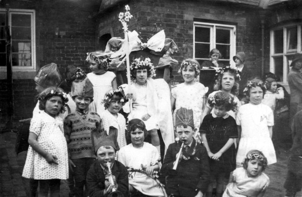 May Queen and children in village school yard