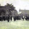 Village band marching in Church Street, inauguration of Edward Prince of Wales