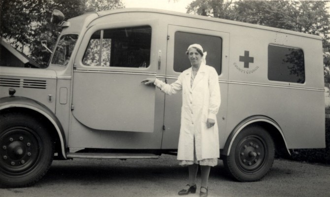 ambulance, nurse standing by passanger door