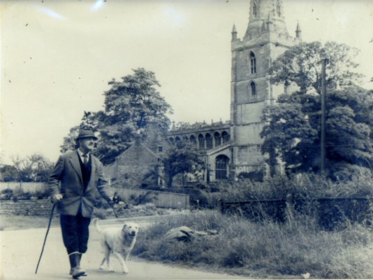BOT169_046_catalogue11 Bob Sutton walking past Bottesford Church
