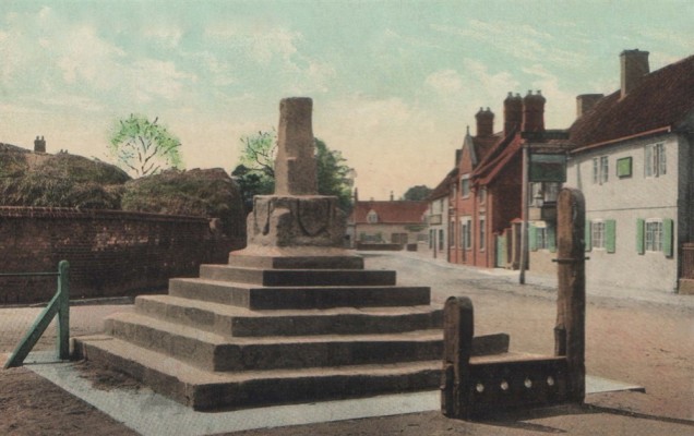 Postcard of Bottesford Cross and Stocks, with Acacia Farm and the Bull in the background