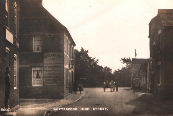 Postcard of the High Street and Rutland Arms