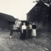 Calcraft family by the barns at Sykes Lane Farm, Muston