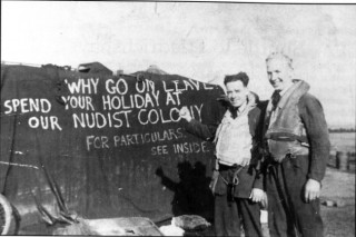 077_Ch10_photo Two groundcrew proudly show their crude (in more ways than one) shelter on the dispersal used by W /0 'Pluto' Wilson's Lancaster, Bottesford, Summer 1943 | ©️Vincent Holyoak