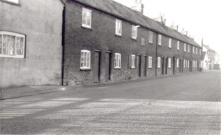 1_Butchers_Row_W._MH_DB_enhanced1 Butcher Row, High Street in the 1960s. Just visible on the left is the gable end of No 13 where William Sutton had his premises - now demolished.