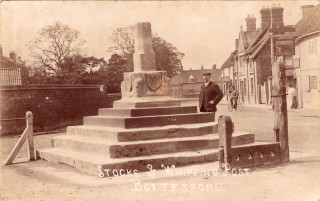 The Cross, Bottesford. Left the wall of the school and beyond  Accacia House and its stock yard. Right The Bull Innand the Coffee House