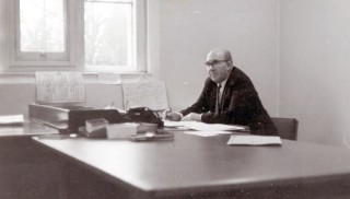 Retired from the police force, behind the desk at St Vincents Dept of Works, Grantham, 1969.