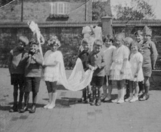 Ada_Bond_set_1_bw_00091 1920s Bottesford Junior School May Queen procession - Mrs Ada Bond recalls that the May Queen was Eva Randell; others in the procession include George Taylor, Ralph Bateson, Joan Tuckwood (Mrs Joan Roberts), Betty Waudby and Bill Waudby