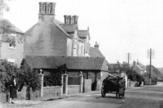 This gabled house with the tall chimneys was at one time occupied by Dr. Wright and may have been no. 12 High Street on the 1881 census.