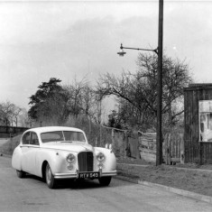 BHLS_Archive_car_by_Greaves_cycke_shed_MH_HER_crop11 Mr. Houghton Ward's car outside Greaves Cycles & Electricals, 1955.