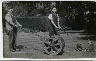 Tommy Robinson, left, rolling the lawn as Bill Sutton marks the lines for a bowling match at the Rectory, Bottesford, 1920/30s. | Bottesford Heritage Archive, from the collection of Bill Sutton.