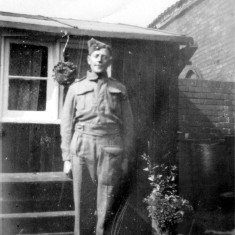 Bolland_0023_Henry__uncle_ Henry (uncle) wearing Pioneer Corps uniform in the yard at Retford Cottages