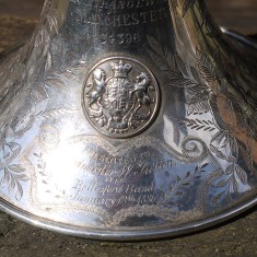 Detail of the royal crest and dedication to W.Sutton, Bandmaster.