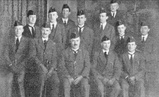 Davidson_Hinds_1924 A photograph at the office of the 2nd Nottingham Company taken at the time of Mr. Oliver Hind's Wedding, in 1924. Front Row: Claude Whittaker; A. Davidson; O. W. Hind; George Guy; Glen Fisher. Second Row: Harry Green; Charles Sansom; William G ant; John C. Stokes; Harry Shaw; G. A. Spick. Back Row: Claude Harris; Albert Pounder.