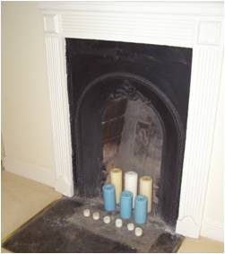 Granby_9 Cast iron fireplace in the rear bedroom.