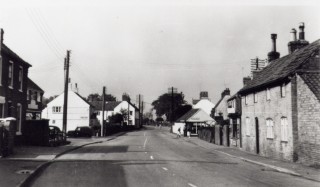 High Street c. 1950  looking to the west end The single story white building on the right is the gas showroom on the corner of Albert (Back) Street mentioned above.