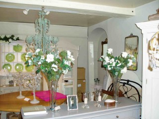 Interior of Rutland Studio showing one of the original arched chimney alcoves and the 18th century boxed beam to the rear of the shop