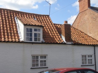 Detail of the roof-line indicating at least two original cottages