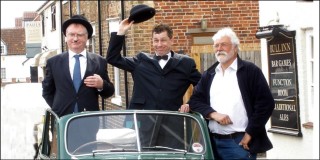 L_H_poster_1 Dave McCormack (left) and Robin Stapleford making a defiant stand in Vic Martin's vintage Morris Minor, outside the Bull, during the 'living history' drama in 2008.