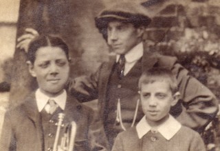 Bob Sutton, as a boy, holding the trumpet.