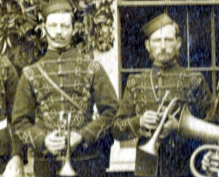 Militia_Band_buglers_crop Two buglers from the Volunteer Rifle Corps Band. This photograph dates from the 1880s, possibly from 1882, when the Bottesford Band joined the Belvoir Volunteers. The man on the left may be John Thomas Cooper, who would have been in his late twenties at the time.